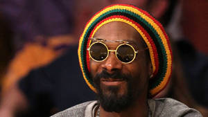 Snoop Dogg Wearing A Rastacap Wallpaper