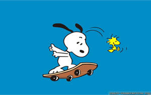 Snoopy And Woodstock Catching Some Thrills On Their Skateboard. Wallpaper