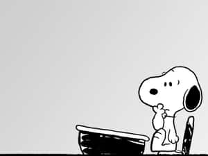 Snoopy Thinkingat Desk Wallpaper