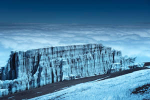 Snow-capped Peaks In The Frozen Land Wallpaper