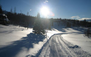 Snow-covered Roads Provide A Chilly Journey. Wallpaper