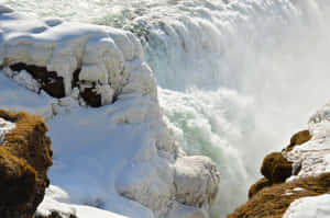 Snow In Gullfoss Waterfall In Southwest Iceland Wallpaper