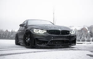 Snowed-on Matte Black Bmw Laptop Wallpaper