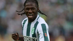 Soccer Player Celebrating On Field Wallpaper