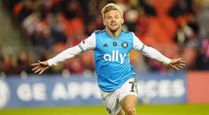 Soccer Player Celebratingon Field Wallpaper