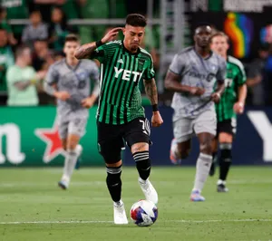 Soccer_ Player_ Controling_ Ball_ During_ Match Wallpaper