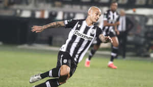 Soccer Player In Action During Match Wallpaper