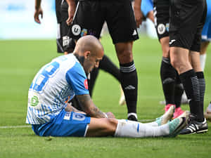 Soccer Player Injury Moment Wallpaper