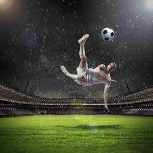 Soccer Player Kicking The Ball Wallpaper