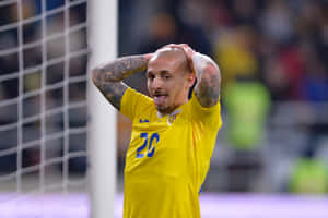 Soccer Player Reaction During Match Wallpaper