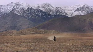 Solitary Himalayan Bike Rider Wallpaper