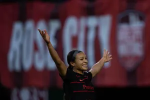 Sophia Smith Walking On A Peaceful Beach At Sunset Wallpaper