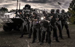 Specialized Swat Police Tank In Action Wallpaper