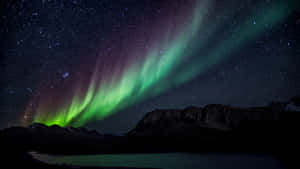 Spectacular Aurora Borealis Illuminating The Night Sky Wallpaper