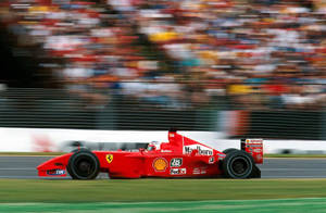 Speeding Michael Schumacher In Race Wallpaper