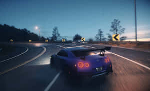 Speeding Sports Car Twilight Drive.jpg Wallpaper