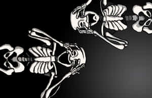 Spooky Halloween Skeleton Shrouded In Darkness Wallpaper