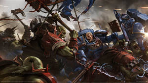 Squad Of Orks Battle Space Marines In Epic Battle Of Warhammer 40k Wallpaper