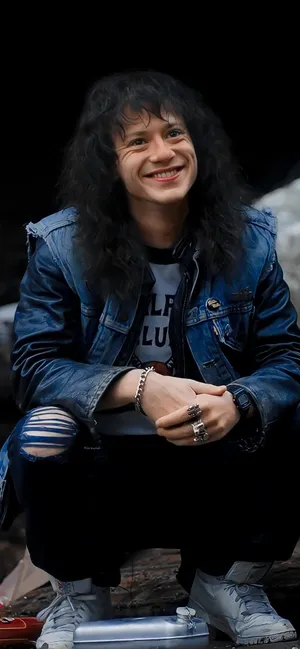 Squatting Eddie Munson Phone Wallpaper