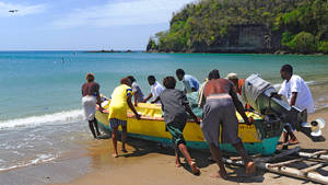 St. Lucia Men Pushing A Boat Wallpaper