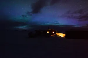 Starry Night Over A Small House Wallpaper