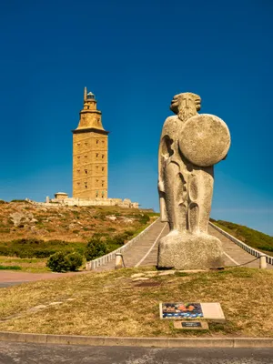 Statue Beside The Tower Of Hercules Wallpaper