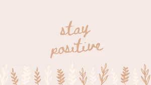 Stay Positive On A Pink Background With A Handwritten Text Wallpaper