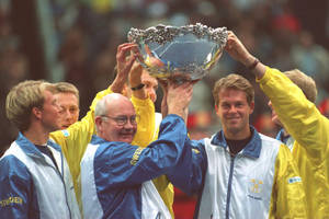 Stefan Edberg Raising Trophy With Teammates Wallpaper