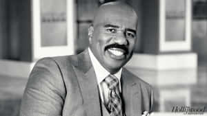 Steve Harvey Delivering A Powerful Speech On Success. Wallpaper