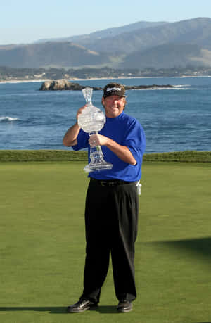 Steve Lowery Posing With Trophy Wallpaper
