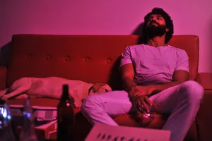 Striking Portrait Of Arjun Reddy From The Acclaimed Movie, Illuminated In Pink Light Wallpaper