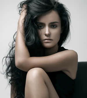 Striking Young Female Model With Curly Black Hair Wallpaper