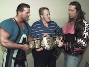 Stu Hart With His Sons Bret Hart And Davey Boy Smith: Legacy Of Wrestling Wallpaper