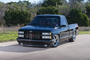 Stunning Black Dropped Truck In Minimalistic Style Wallpaper