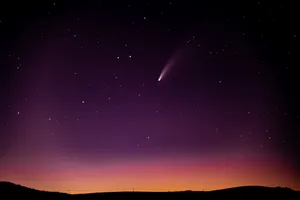Stunning Comet Travelling Through The Star-studded Night Sky Wallpaper