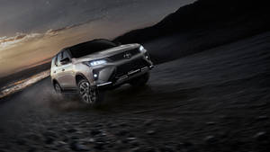 Stunning Silver Metallic Toyota Fortuner Legender In Action Wallpaper