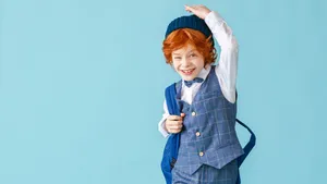 Stylish Boy In School Outfit Wallpaper