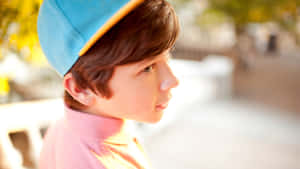 Stylish Boy With Cap Close Up Wallpaper