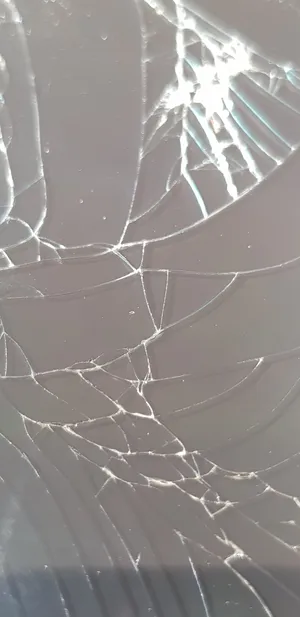 Stylish Image Of Broken Glass Screen Wallpaper