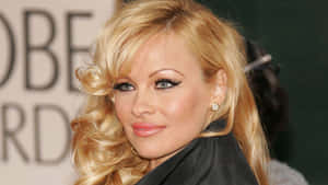 Stylish Pamela Anderson Posing In A Classy Monochrome Outfit Wallpaper