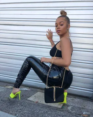 Stylish Woman Posing Against Shutter Wallpaper