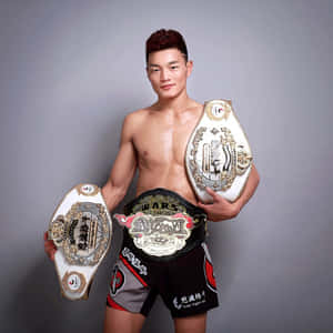 Su Mudaerji Posing With Title Belts Wallpaper