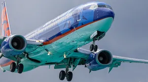 Sun Country's Majestic Flight At Sunset Wallpaper