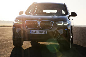 Sun Flare On A Black Bmw Wallpaper