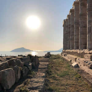 Sun In Sky Over Sounion Wallpaper