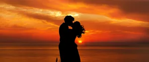 Sunset Couple Kiss Wallpaper