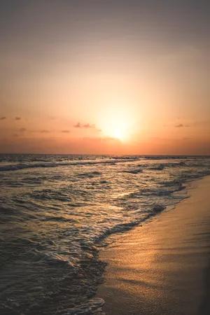 Sunset Over The Beach Android Wallpaper