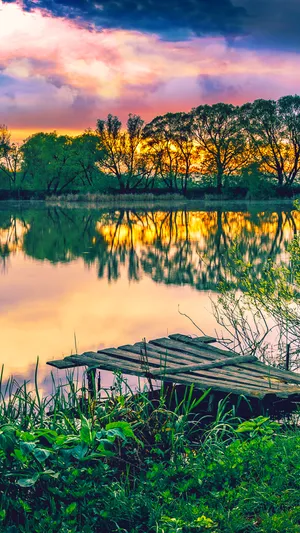 Sunset Reflections At Lakeside Pier.jpg Wallpaper