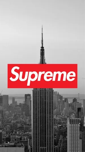 Supreme Logo In Black And White With The Empire State Building Wallpaper