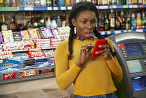 Surprised Shopper Checking Phone Wallpaper